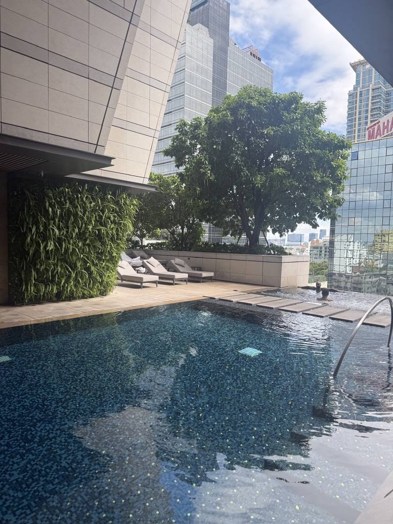 Rooftop pool above the city at dusk