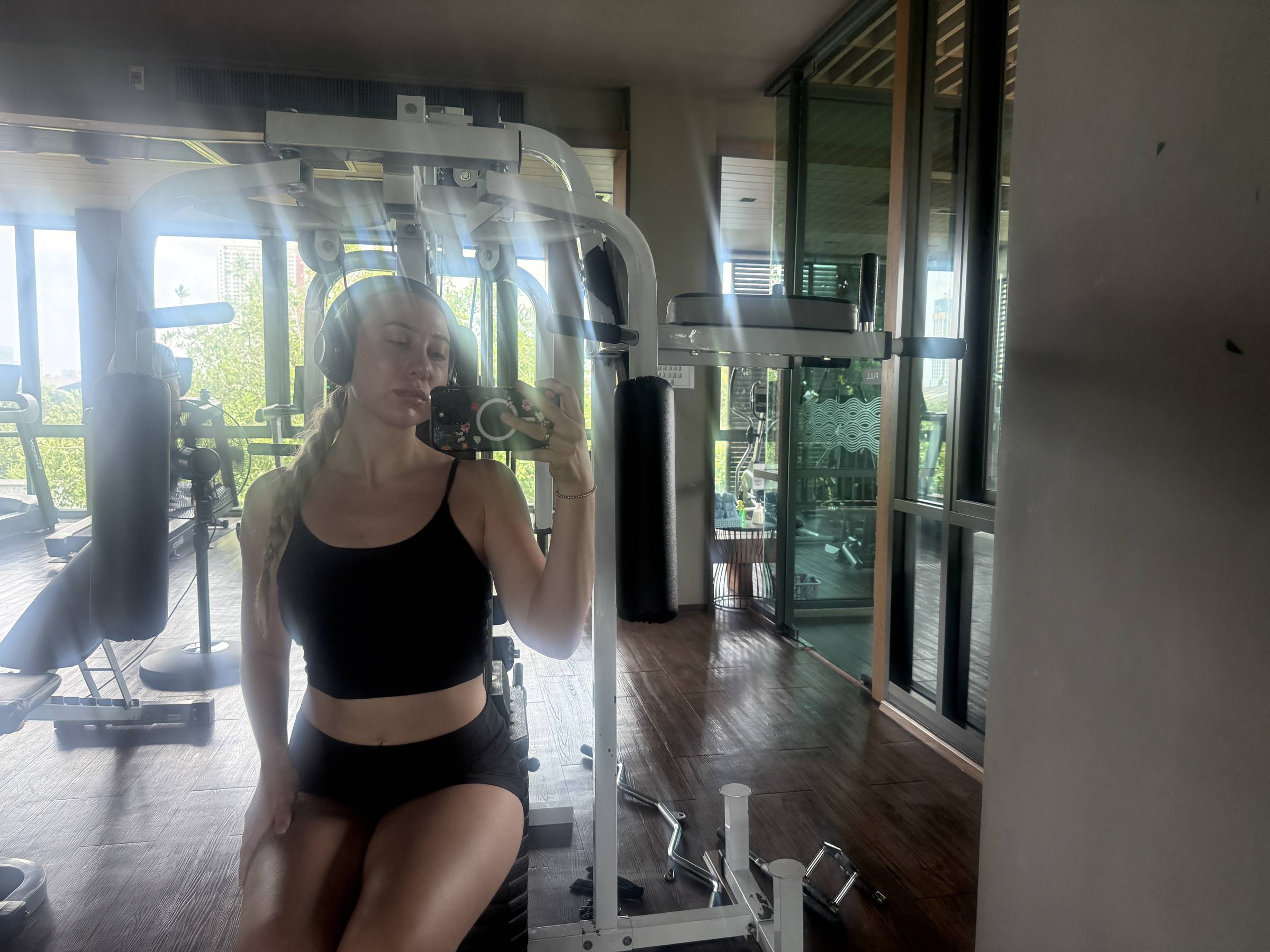 Hotel gym mirror selfie among the machines