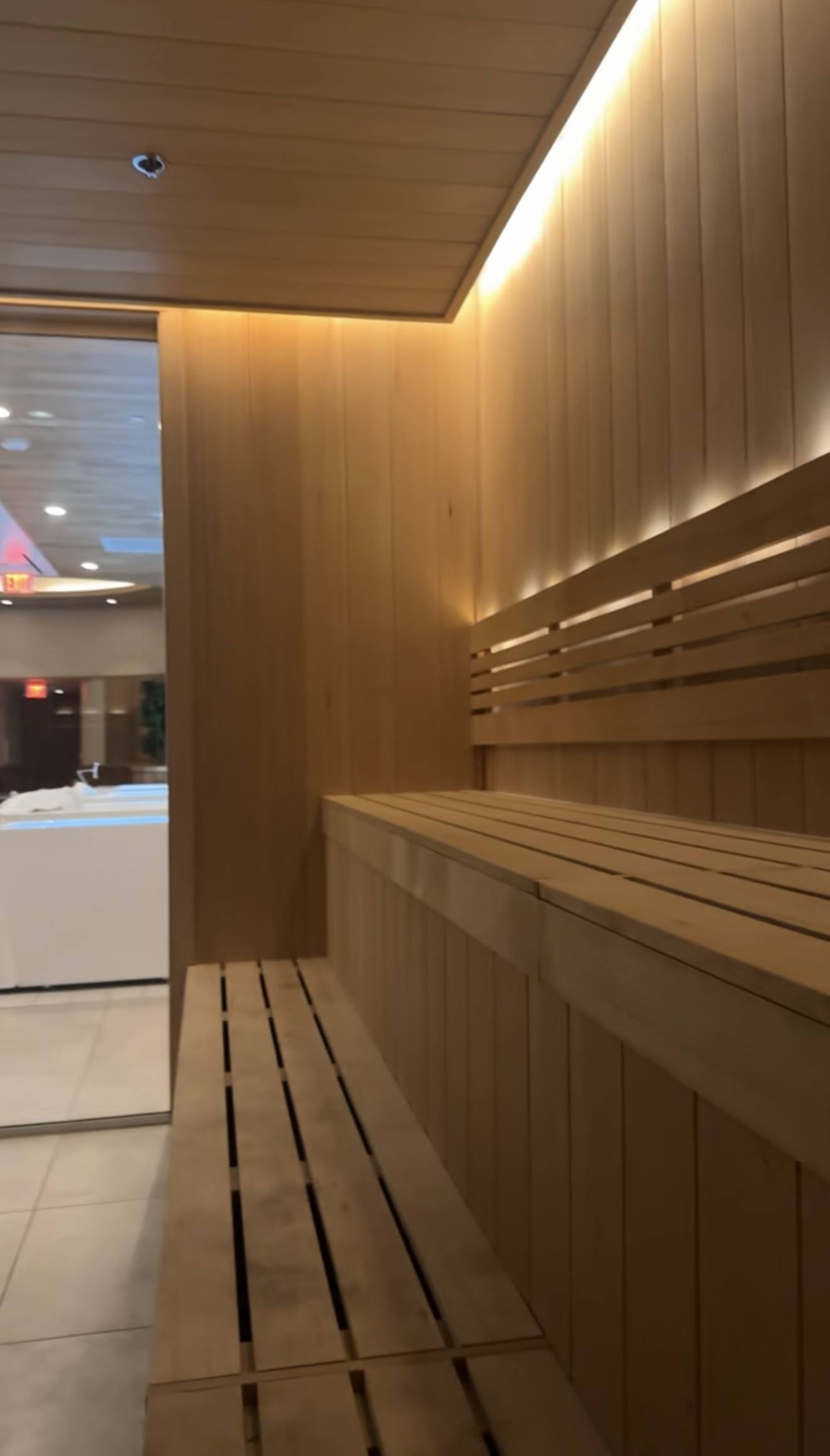 Inside the sauna, wood panelling and low light