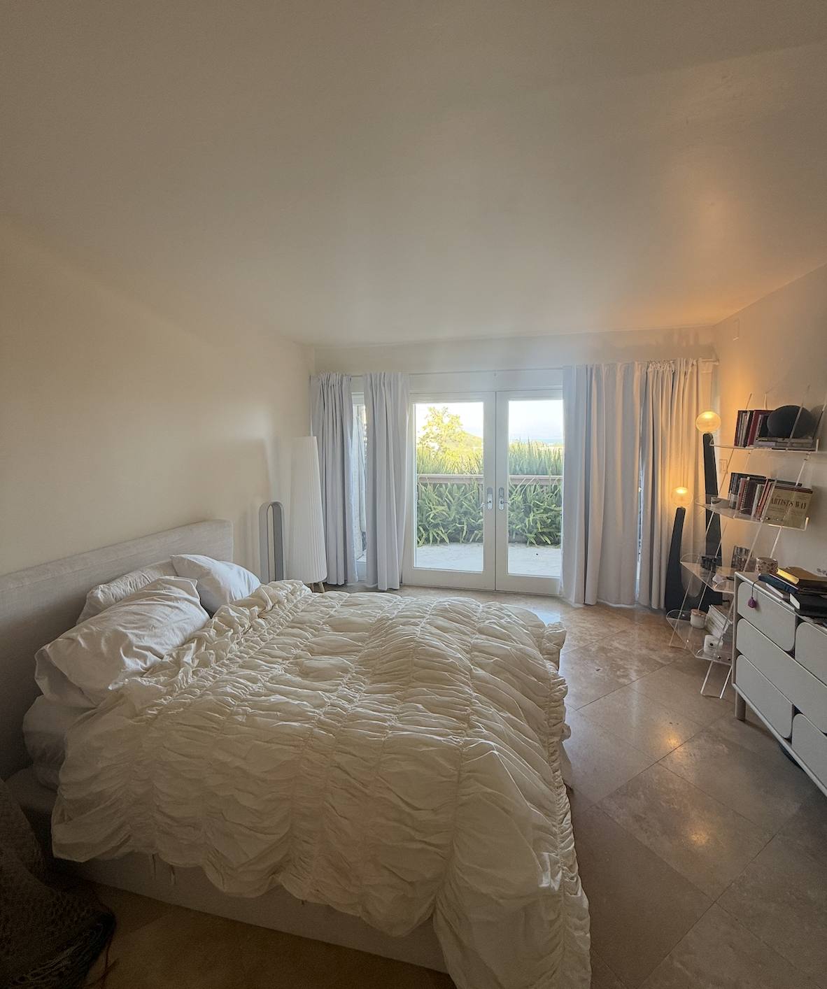 The bedroom, linen curtains to the floor