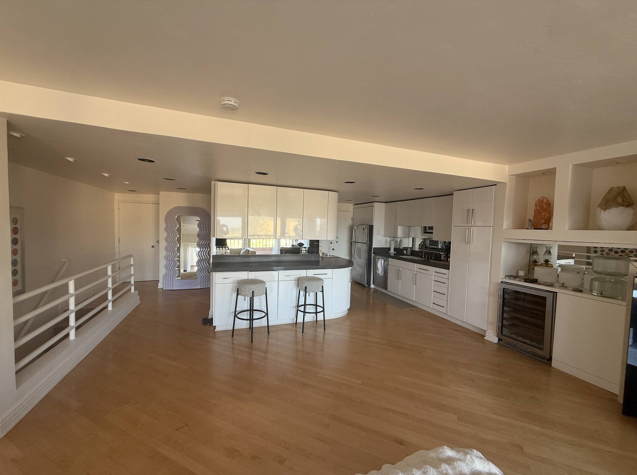 The kitchen with bouclé counter stools