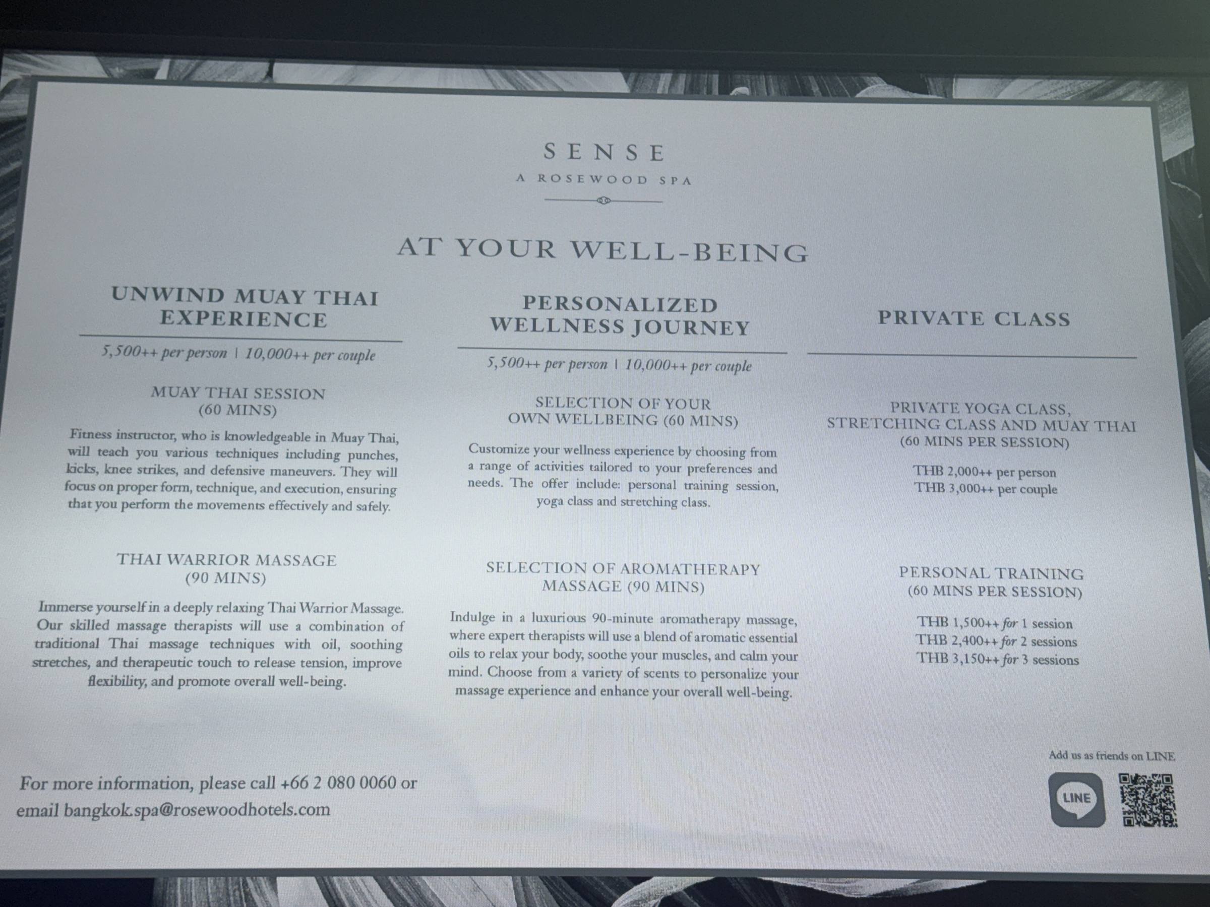 A printed spa and wellness menu listing treatments