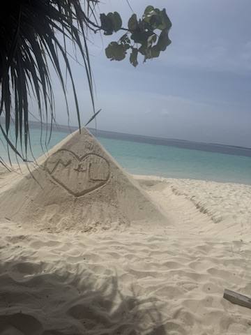 Sand pyramid carved with M + L